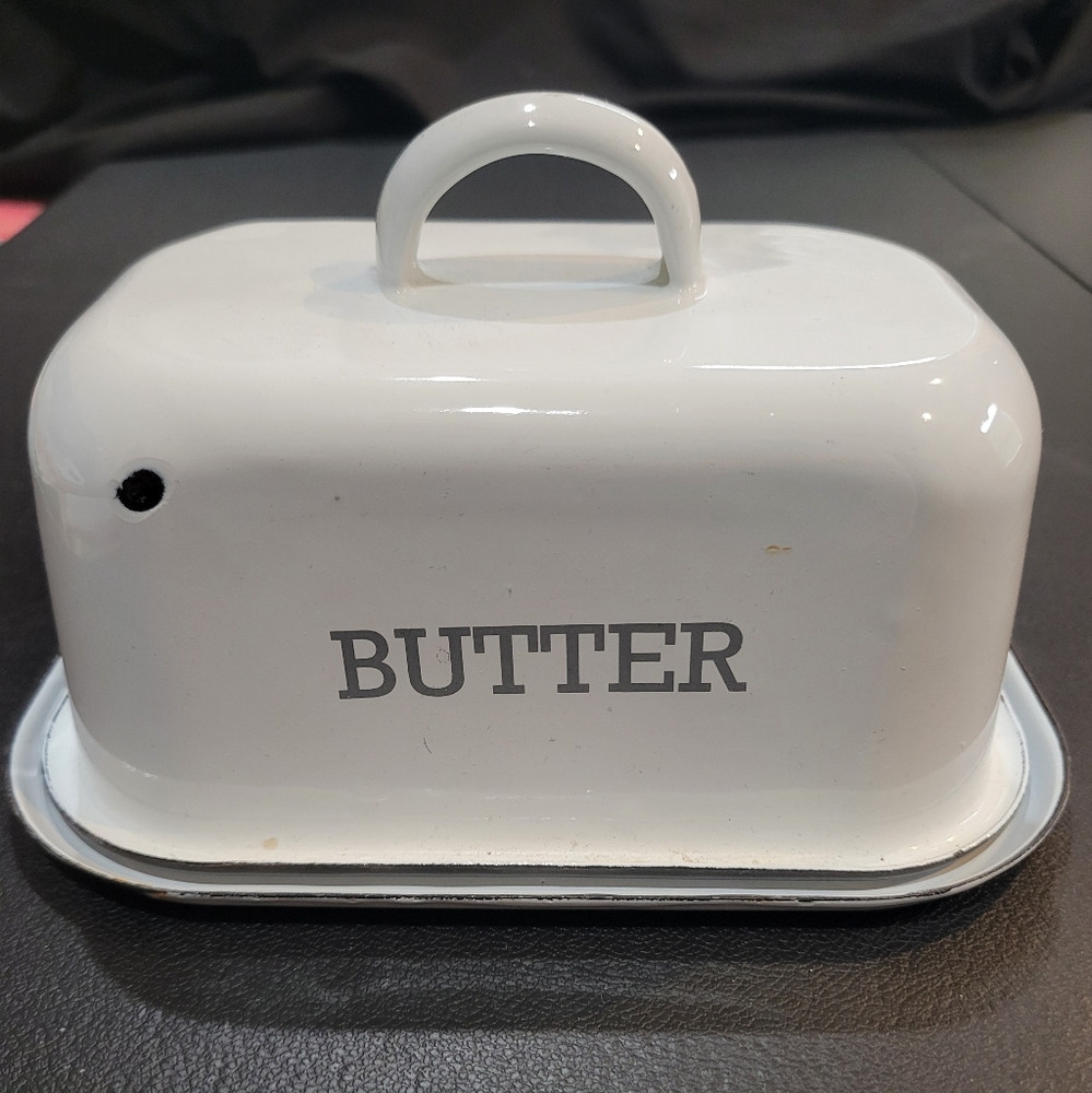 Metal/enamal butter dish with cover.  Like new.  It is from Hobby Lobby.